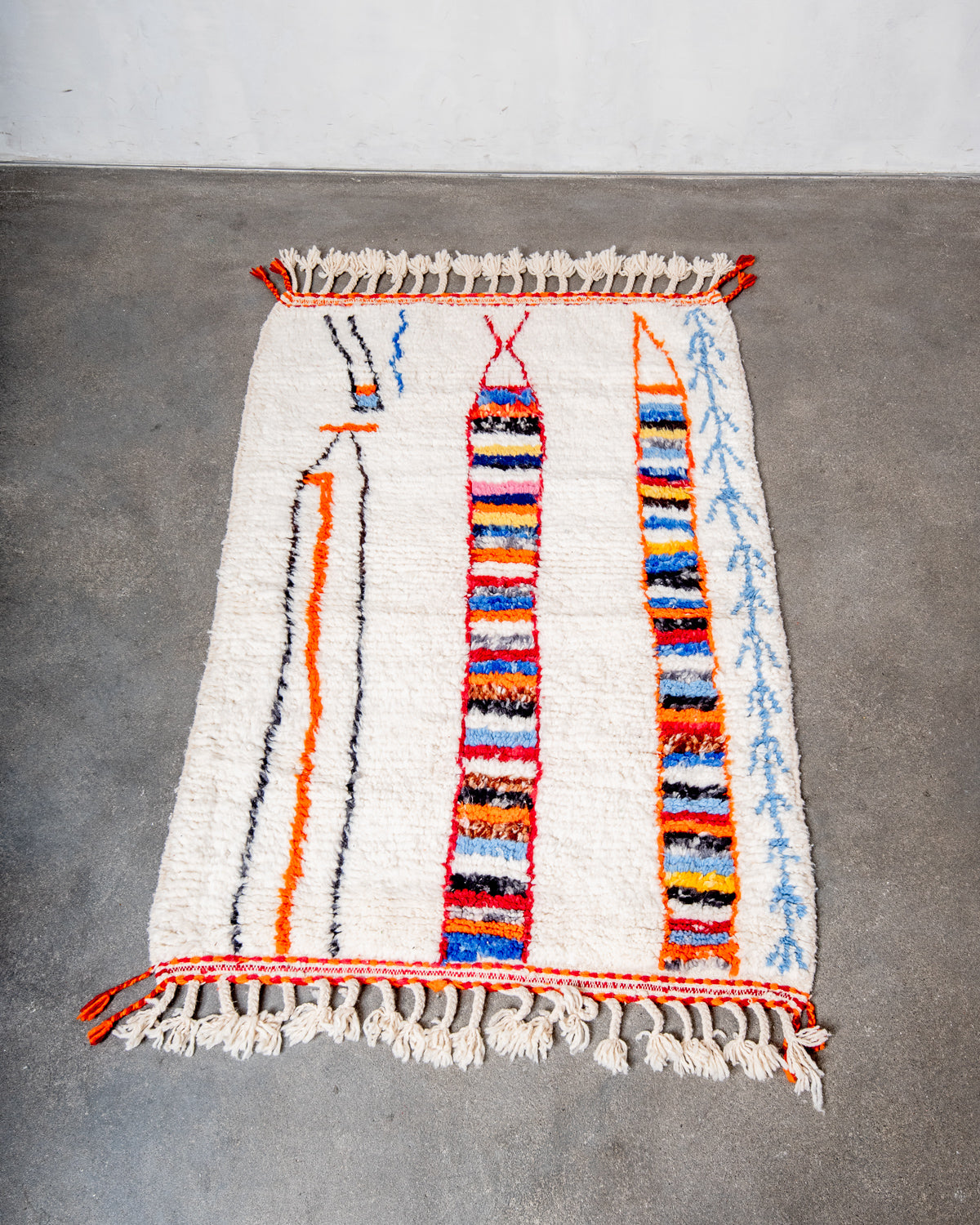 Modern, designer, handcrafted Berber rug from Morocco. Beniourain carpet with beautiful colours and patterns and fluffy wool texture.